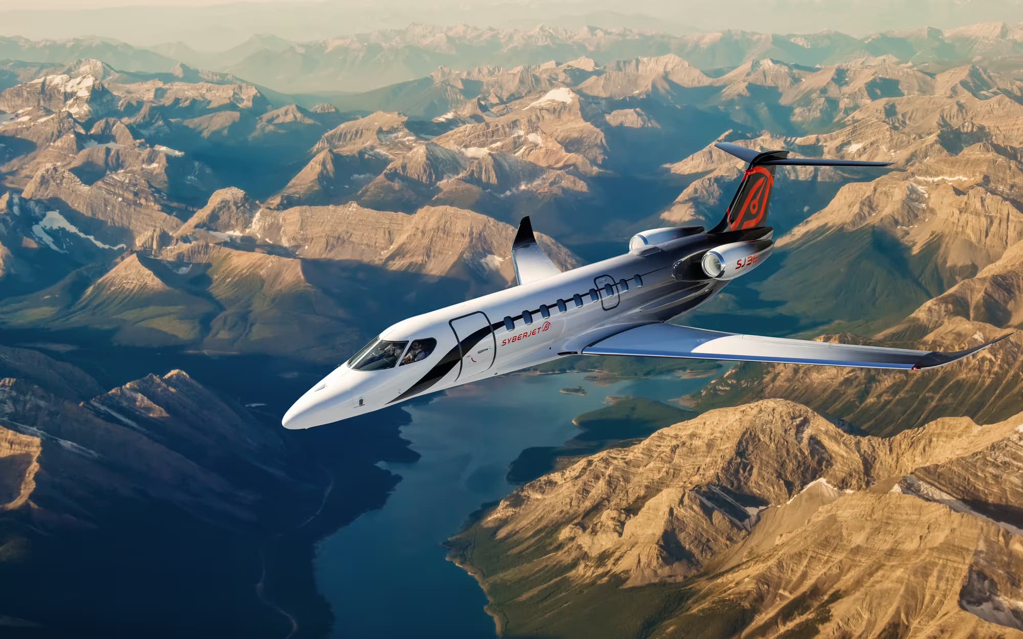 SJ36 in flight over mountains