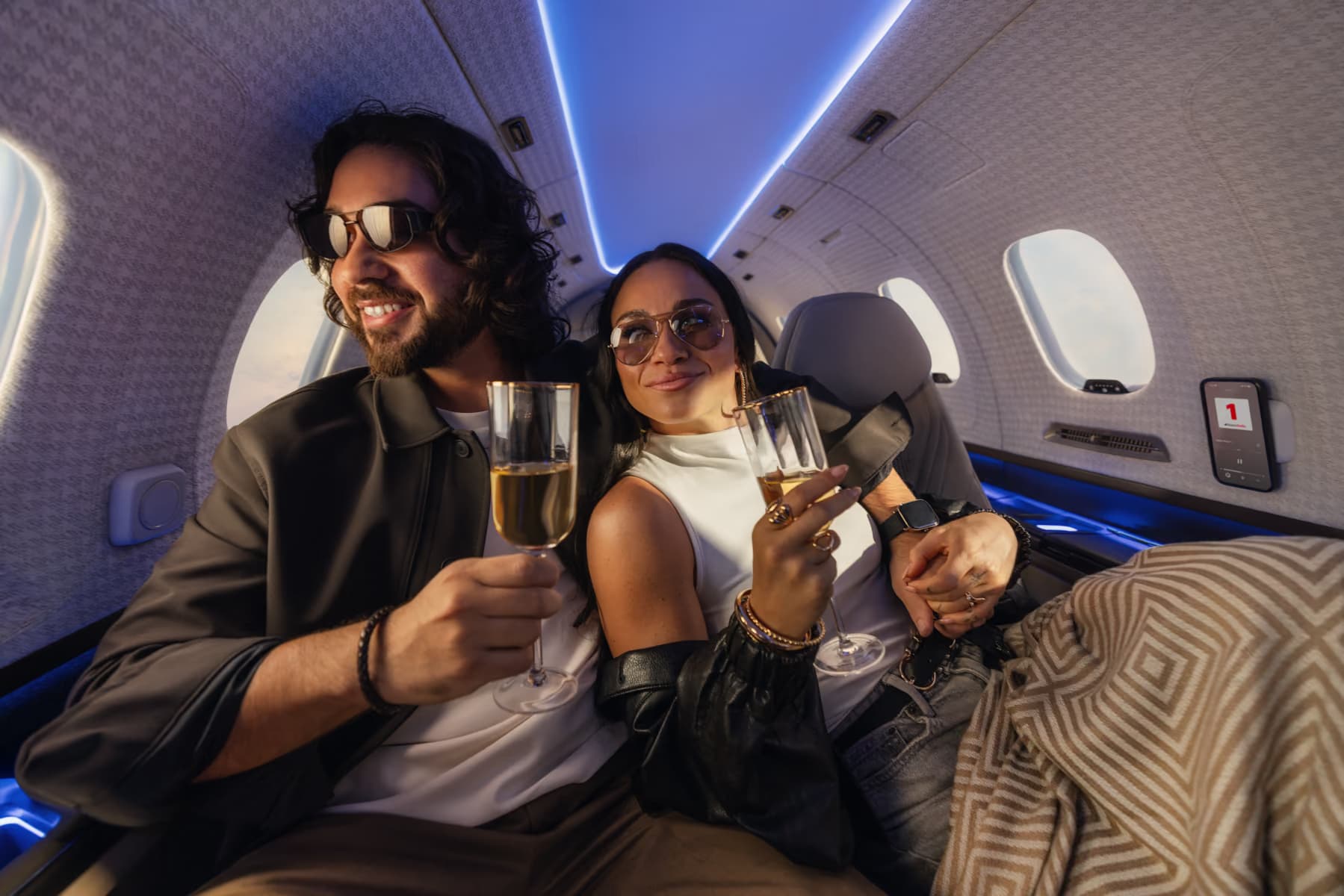 Two passengers toasting in the SJ36 cabin
